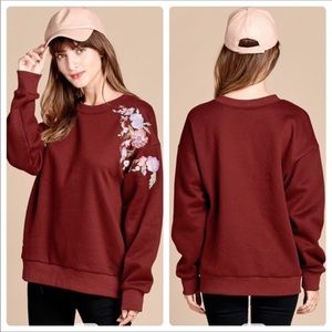 Wine colored sweatshirt flower detail
